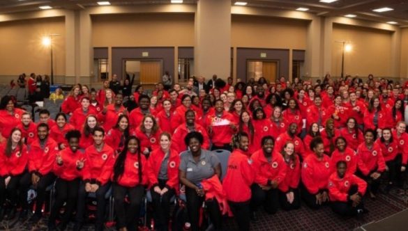City Year Philadelphia's entire team of AmeriCorps smile at the camera.