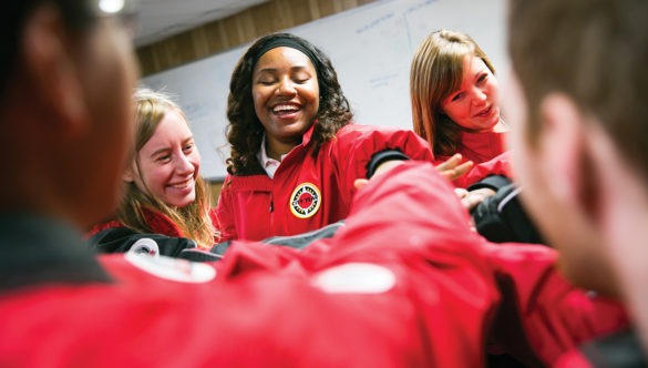 americorps members place their hands in a spirit break