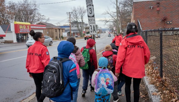 Students are guided to school by City Years on the walking bus