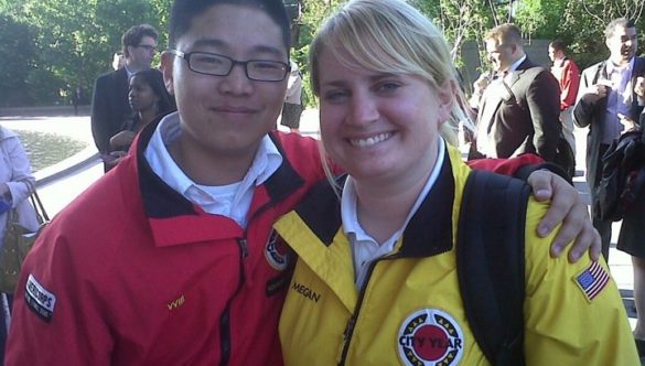 Two City Year AmeriCorps members red jacket yellow jacket